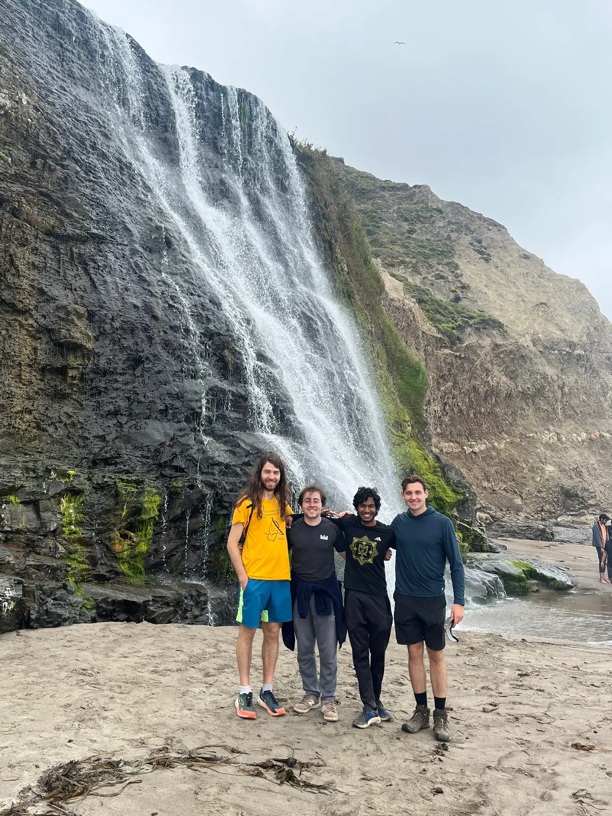 The Thunder Compute team hiking out to a waterfall